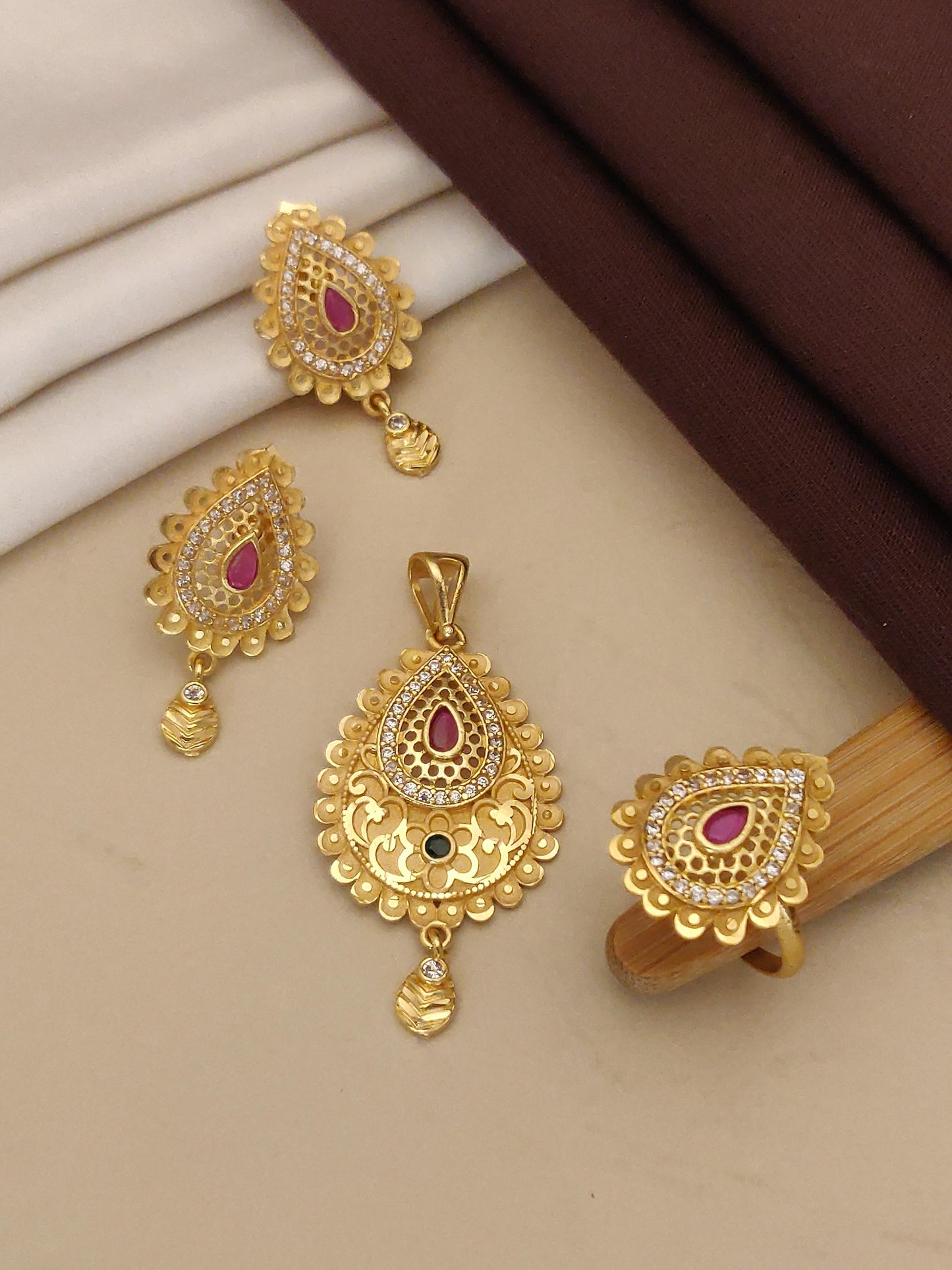 designer high gold plated ad diamond studded facny forming pendent set with earring and ring