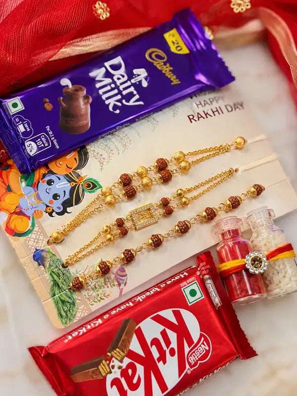 Premium Rudraksha Rakhi Chocolate Gift Hamper for Brother – Set of 3 Rakhis with Dairy Milk, KitKat, Roli & Chawal