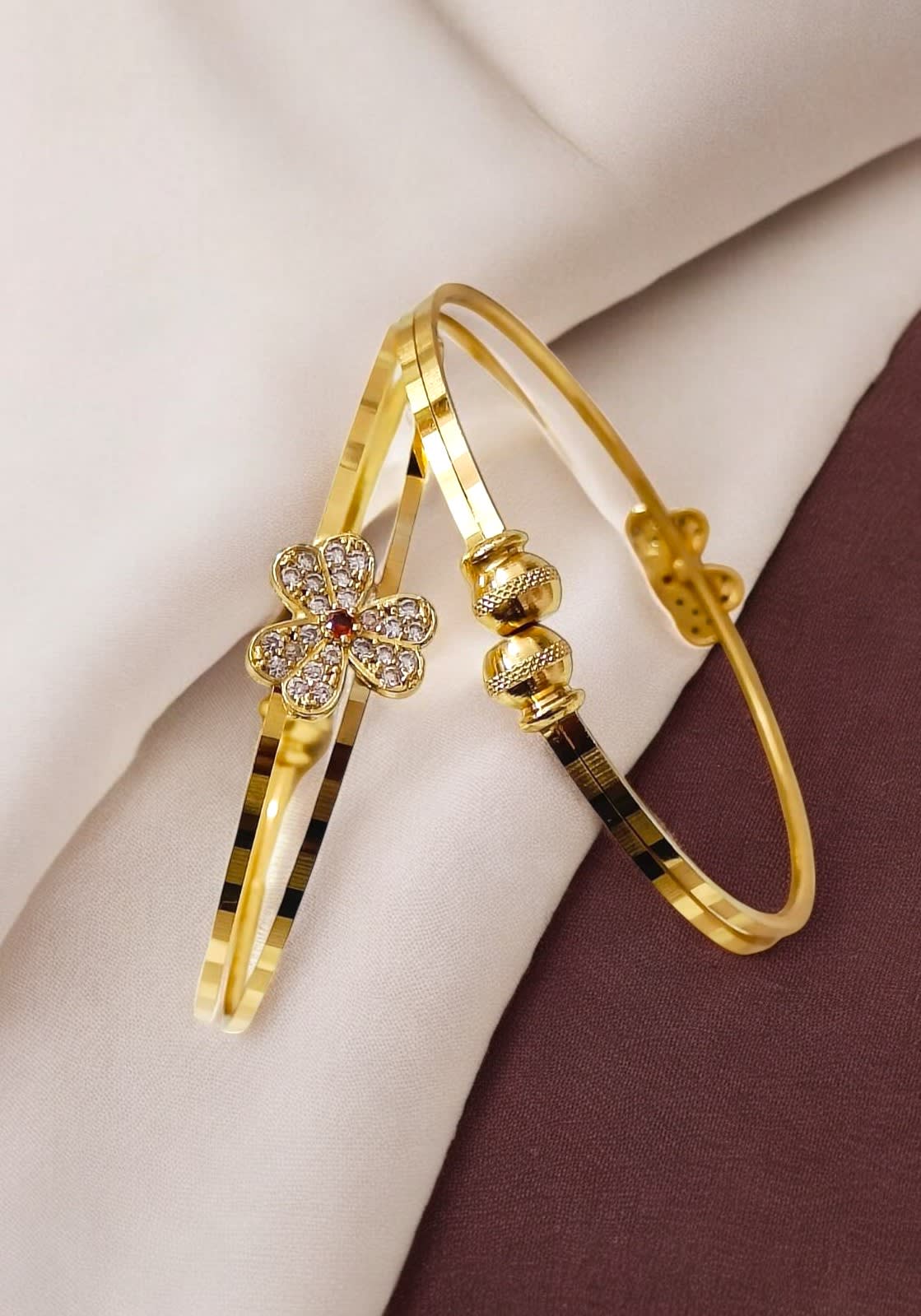 designer high gold pated ad diamond studed fancy flower kadli