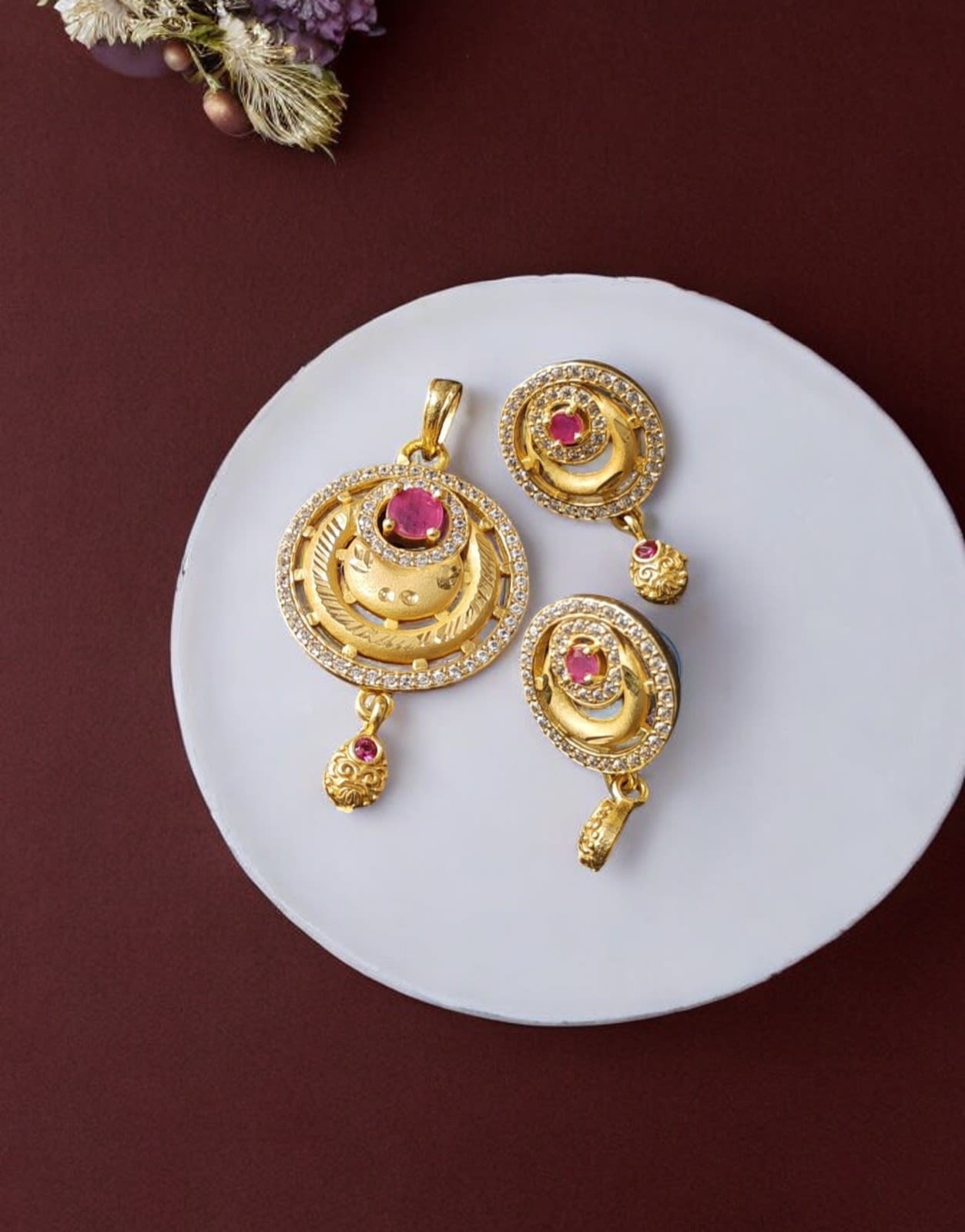 High Gold Plated Stunning American Diamond And Pink Diamond Studded Forming Designer Round Shape Pendent Set