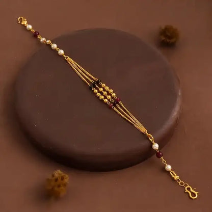 Premium Gold-Plated Bhabhi Rakhi with Pearl & Ruby Beads