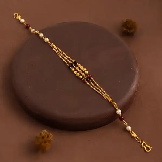 Premium Gold-Plated Bhabhi Rakhi with Pearl & Ruby Beads