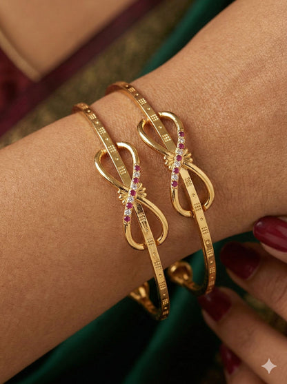 Elegant Infinity Bow Micro Gold Plated Ruby And Designer Bangles (Set Of 2)