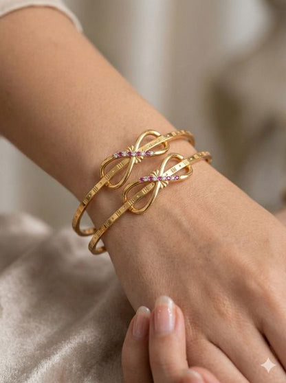 Elegant Infinity Bow Micro Gold Plated Ruby And Designer Bangles (Set Of 2)