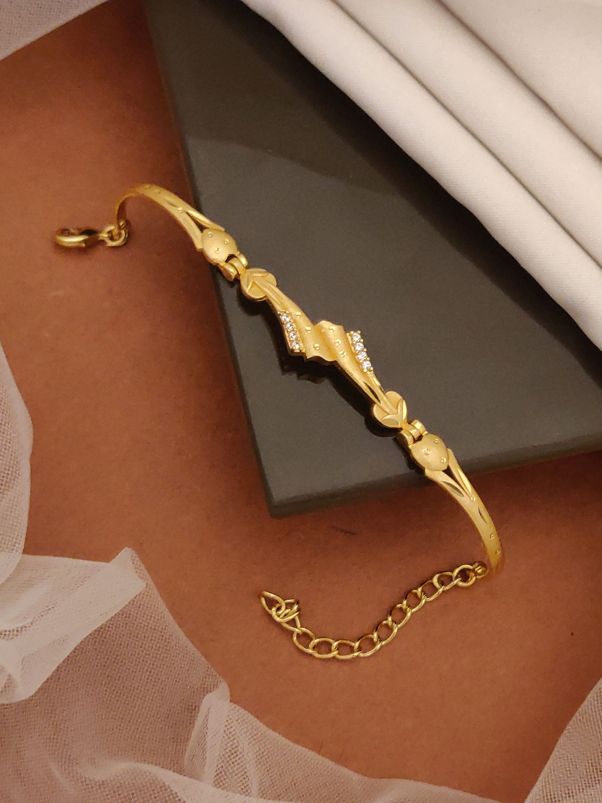 Gold Plated And Diamond Studded Fancy Forming Bracelet